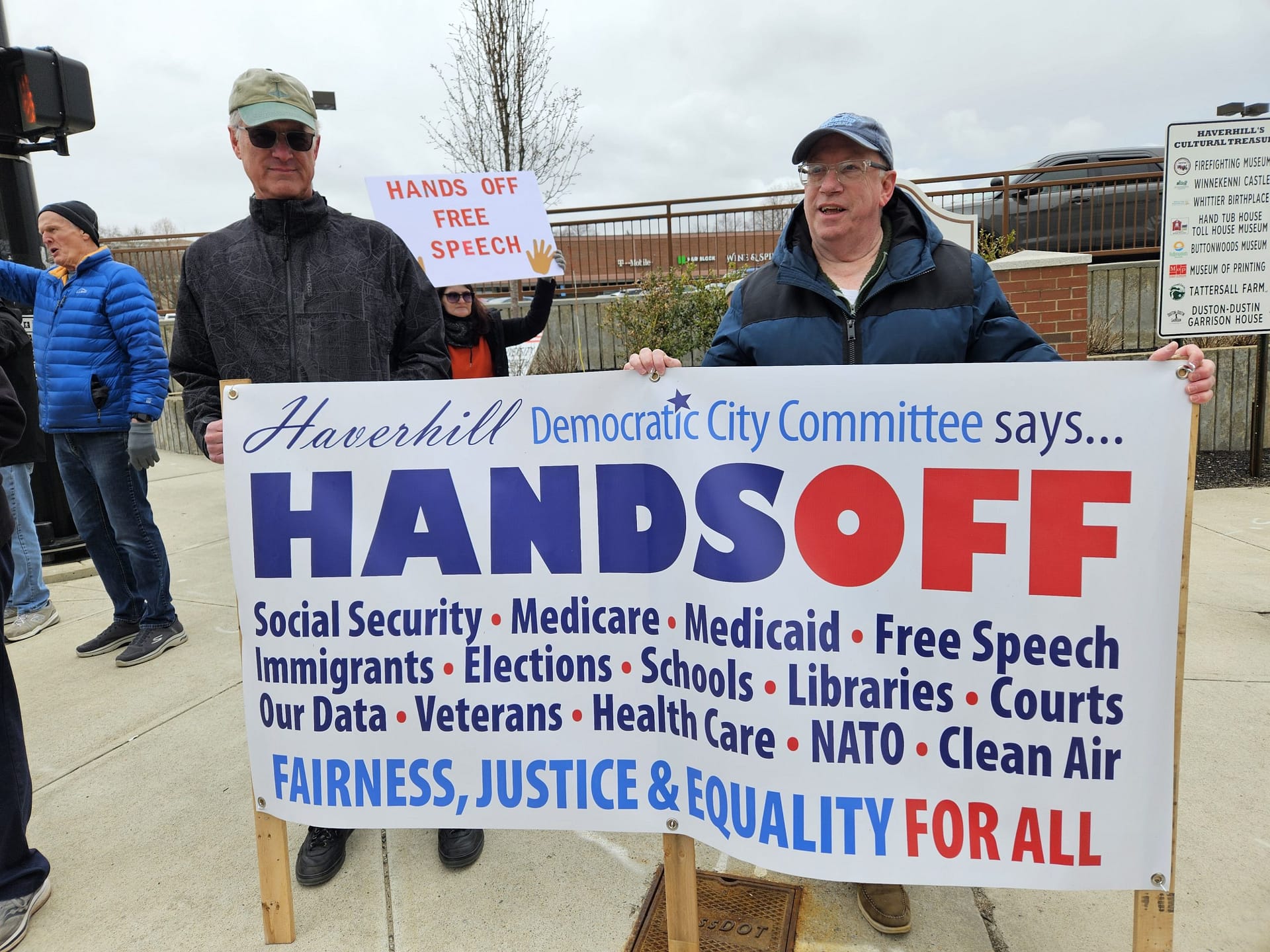 Joe LeBlank and Bill Cox holding HDCC Hands-Off banner